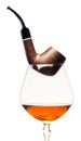 Cognac and pipe on white background Royalty Free Stock Photo