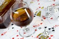 Cognac and playing card Royalty Free Stock Photo
