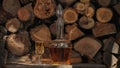 Cognac pouring in the glass from bottle. Hand puts a carafe with golden cognac Royalty Free Stock Photo