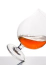 Cognac in wineglass isolated on white