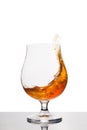 Cognac in wineglass isolated on white