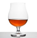 Cognac in wineglass isolated on white