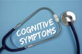 Cognitive Symptoms text with Stethoscope on blue background Royalty Free Stock Photo