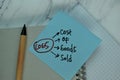 COGS - Cost Of Goods Sold write on sticky note isolated on Wooden Table Royalty Free Stock Photo
