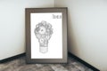 Cogwheel lamp in frame