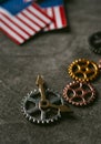 Cogwheels, clock hands and american flags