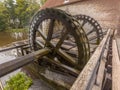 Cogwheels at a watermill Royalty Free Stock Photo
