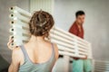 A young couple installs a decorative beam in the apartment