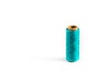 A coil of aqua thread. Spool of colored threads on a white background. Waxed sewing thread for leather crafts. Royalty Free Stock Photo