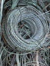 Coil of copper wire with green Verdigris oxidisation ready for recycling