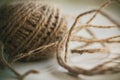 A coil of fluffy beige hemp rope with a tangled end Royalty Free Stock Photo