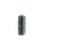 A coil of gray thread. Spool of colored threads on a white background. Waxed sewing thread for leather crafts. Royalty Free Stock Photo