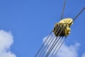 Coil for the iron cable in the tower crane against the blue sky. Mechanical component for crane operatio Royalty Free Stock Photo