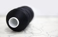 Coil of lavsan kapron economic and household thread for sewing, finishing and embroidery of products from non-shrink fabrics, natu