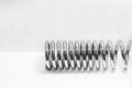 The coil spring on the white background. Royalty Free Stock Photo