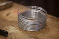 Twisted wire in a circle.  Subject in the workshop.  Steel thread. Royalty Free Stock Photo