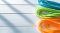 Coiled Colored Cords on White Wood Royalty Free Stock Photo