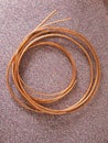 Coiled copper tubing for refrigeration system. Royalty Free Stock Photo