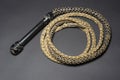 Bullwhip with black leather handle