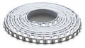 Coiled LED strip light comprised of a flexible circuit board hosting small, evenly spaced light-emit Royalty Free Stock Photo