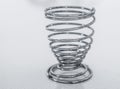 A coiled metal egg holder Royalty Free Stock Photo