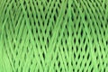 Coiled nylon rope texture background. Green rolled  striped nylon rope pattern. A coil of new colored rope surface Royalty Free Stock Photo
