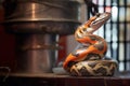coiled python under a heat lamp