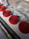 Coiled red fire hoses Royalty Free Stock Photo