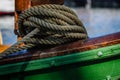 Coiled rope on the edge of a ship Royalty Free Stock Photo