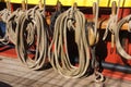 Coiled rope lines stored on belaying pins Royalty Free Stock Photo