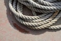 Coiled rope sits on a an old dock Royalty Free Stock Photo