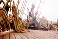 Coiled ropes organized on a sunlit ship deck, ready for sailing Royalty Free Stock Photo