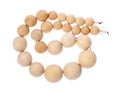 Coiled string of wooden beads isolated