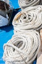 Coiled thick rope on the ship in a spiral or sequence of ring. Royalty Free Stock Photo