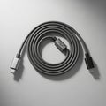 Coiled USB C cable in gray featuring metal connectors on both ends Royalty Free Stock Photo