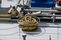 Coiled yellow ship hawsers on the deck of an inland tanker