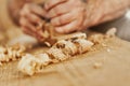 Coils of fresh wood shavings on a woodworking workbench Royalty Free Stock Photo