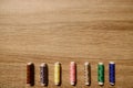 The coils of threads put on wooden table Royalty Free Stock Photo