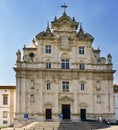 Coimbra, Portugal, August 13, 2018: Facade of the new Cathedral of Coimbra in Baroque Mannerist style seen from the street called