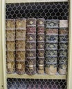 Ancient books in a row protected by a wire screen in a library in Portugal Royalty Free Stock Photo