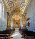 Altar and aisle of Saint Michaels Chapel Capela de Sao Miguel at University of Coimbra Courtyard - Coimbra, Portugal