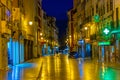 COIMBRA, PORTUGAL, MAY 20, 2019: Night view of people strolling through boulevard Ferreira Borges at central Coimbra, Portugal Royalty Free Stock Photo