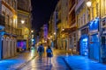 COIMBRA, PORTUGAL, MAY 20, 2019: Night view of people strolling through boulevard Ferreira Borges at central Coimbra, Portugal Royalty Free Stock Photo