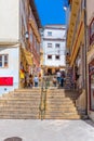 COIMBRA, PORTUGAL, MAY 20, 2019: View of a narrow street at the old town of Coimbra, Portugal Royalty Free Stock Photo