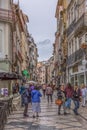 View at the Ferreira Borges Street, Downtown street in Coimbra city, persons and classic buildings