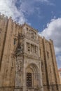 Coimbra / Portugal - 04 04 2019 : View of lateral facade of the gothic building of Coimbra Cathedral, Coimbra city and sky as