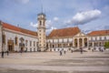 View of the tower building of the University of Coimbra, classic architectural structure with masonr and other classic buildings