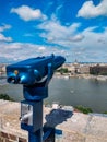 Coin binoculars in European beautiful city in summer