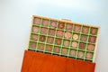 Coin case with numismatic collection of antique coins. Plastic and wooden numismatic album. Selective focus Royalty Free Stock Photo