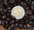 Coin and coffee beans